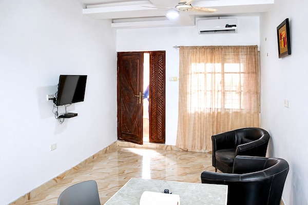 Living room with Tv,air condition and a dining space