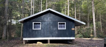 Charming 3 bedroom cabin directly on rushing creek! Fish from the deck! 