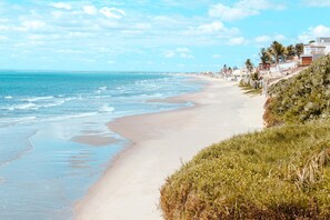 On the beach, sun-loungers, beach umbrellas