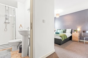 Shower, hair dryer, towels, toilet paper