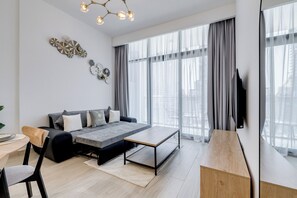 Deluxe Apartment, 2 Bedrooms, Kitchen, City View | Living area | 43-inch flat-screen TV with cable channels, Netflix, streaming services - GLOBALSTAY. Azizi Riviera 40 (Dubai)