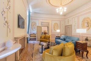 Elite Suite, Balcony, City View | Living area | 52-inch flat-screen TV with satellite channels