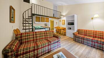 Televisión, chimenea, reproductor de DVD, futbolito