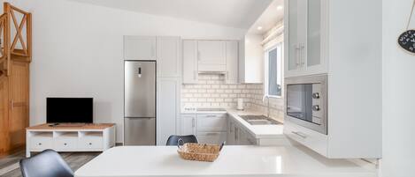 Fridge, microwave, stovetop, coffee/tea maker