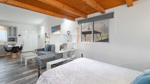 A modern room with a bed, a sofa, a dining area, and a kitchen. - Studio 'De Tato' with Mountain View, Private Terrace and Wi-Fi (La Frontera)