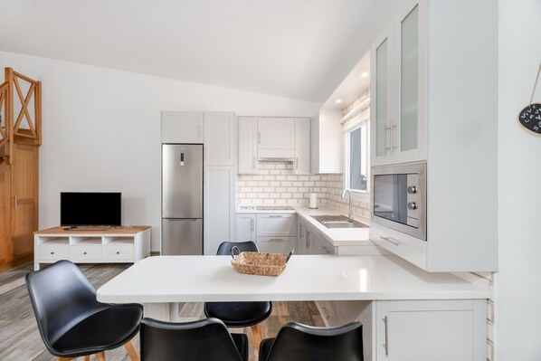 Fridge, microwave, stovetop, coffee/tea maker