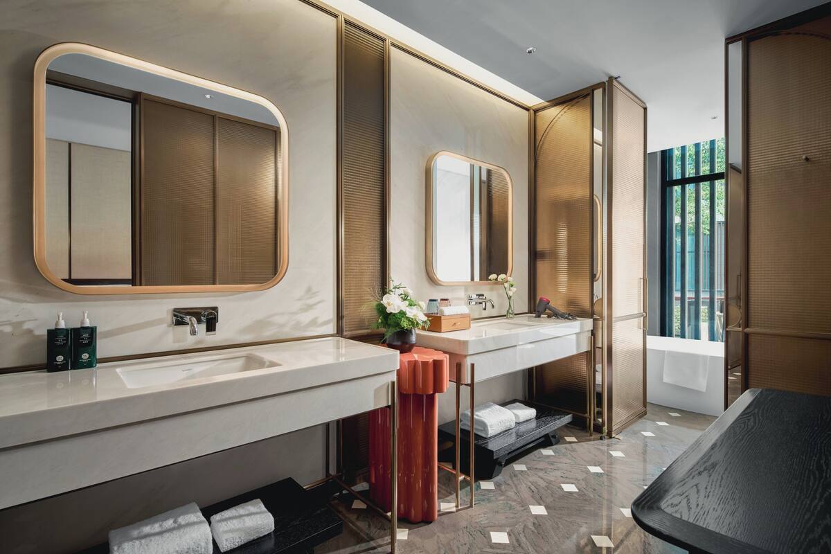 Designer toiletries, hair dryer, bathrobes, slippers