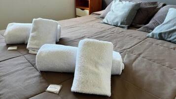 Premium bedding, pillow-top beds, blackout curtains, free WiFi