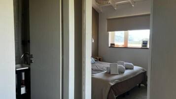 Premium bedding, pillow-top beds, blackout curtains, free WiFi