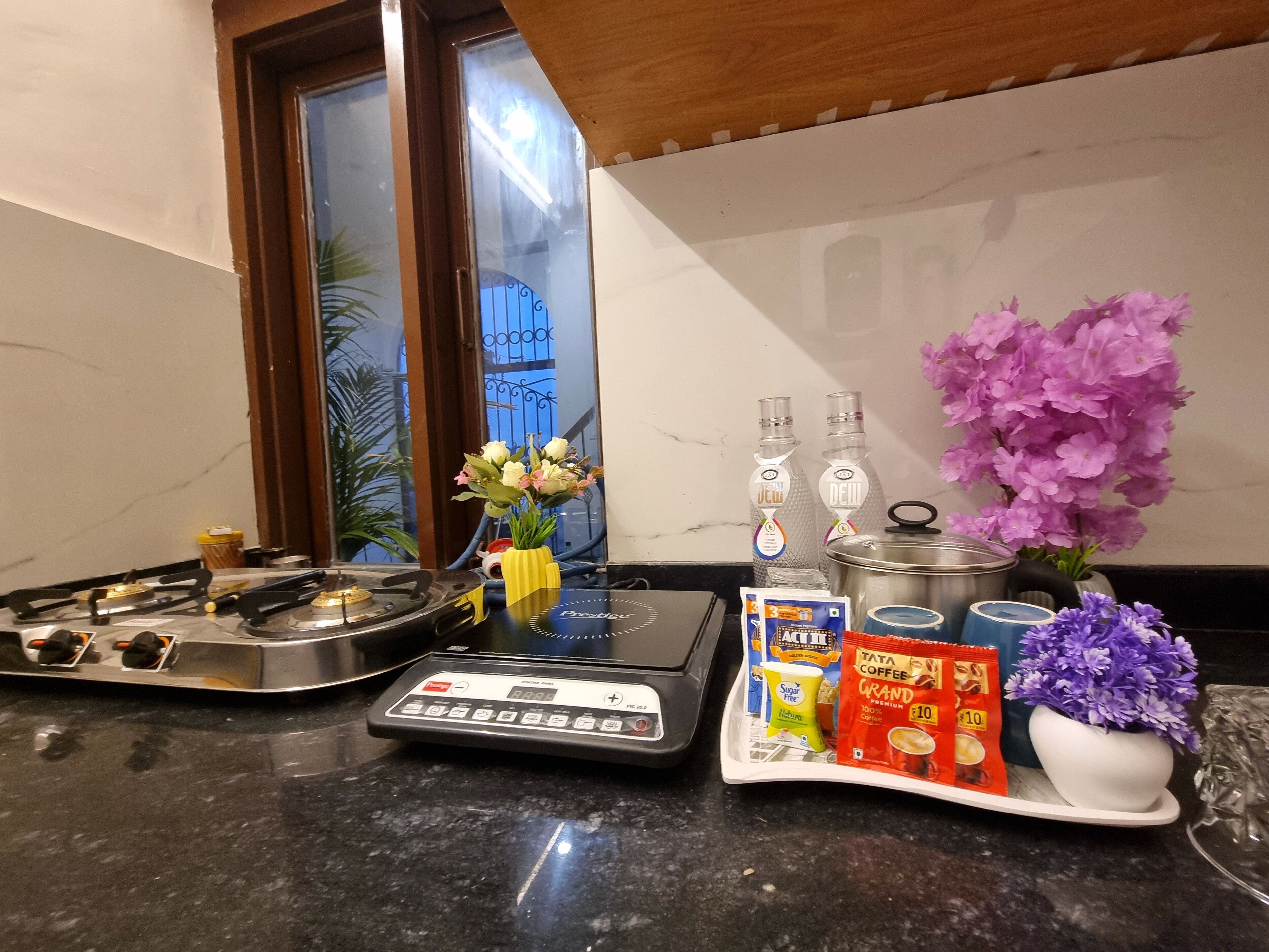 Fridge, stovetop, electric kettle, cookware/dishes/utensils