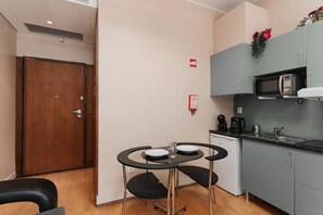 Fridge, microwave, stovetop, coffee/tea maker