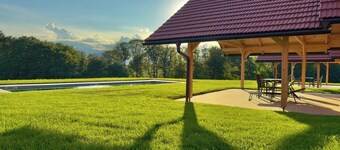 Cozy Wooden Chalet with Heated Pool – Scenic Green Views in Styria