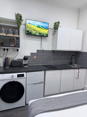 Fridge, microwave, stovetop, coffee/tea maker