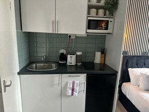 Fridge, microwave, stovetop, coffee/tea maker