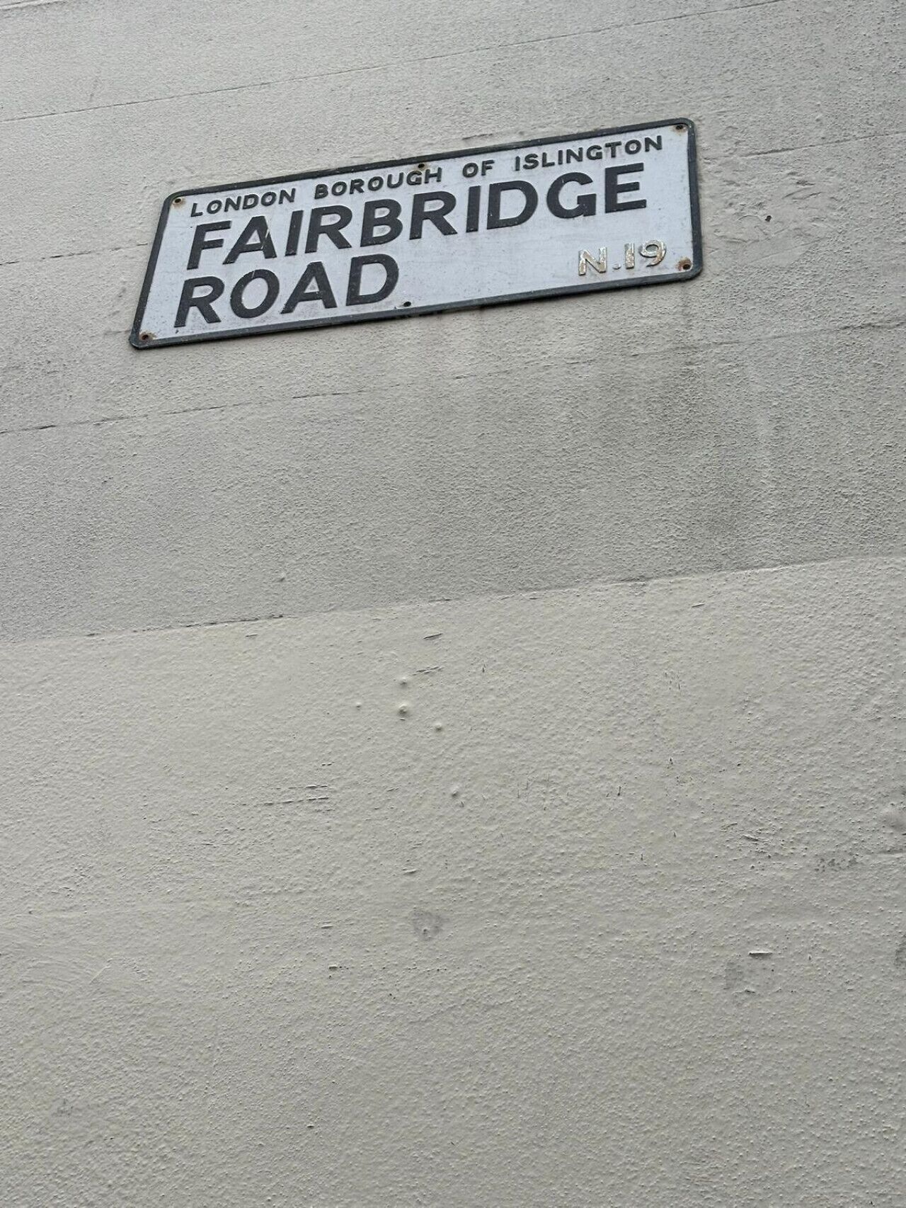 A street sign for 'Fairbridge Road' in the London Borough of Islington.