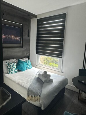 1 غرفة نوم ومكواة/لوح كي وواي فاي وملاءات أسرّة