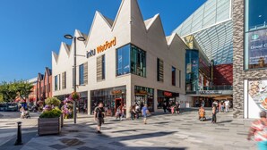 A modern building with a unique triangular roof design, featuring a prominent 'intu Watford' sign. - Market street 33A - 2 - second floor (Watford)