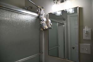 Shower, towels, soap, toilet paper