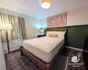 Suite, Patio, Beach View | Laptop workspace, blackout curtains, iron/ironing board, free WiFi