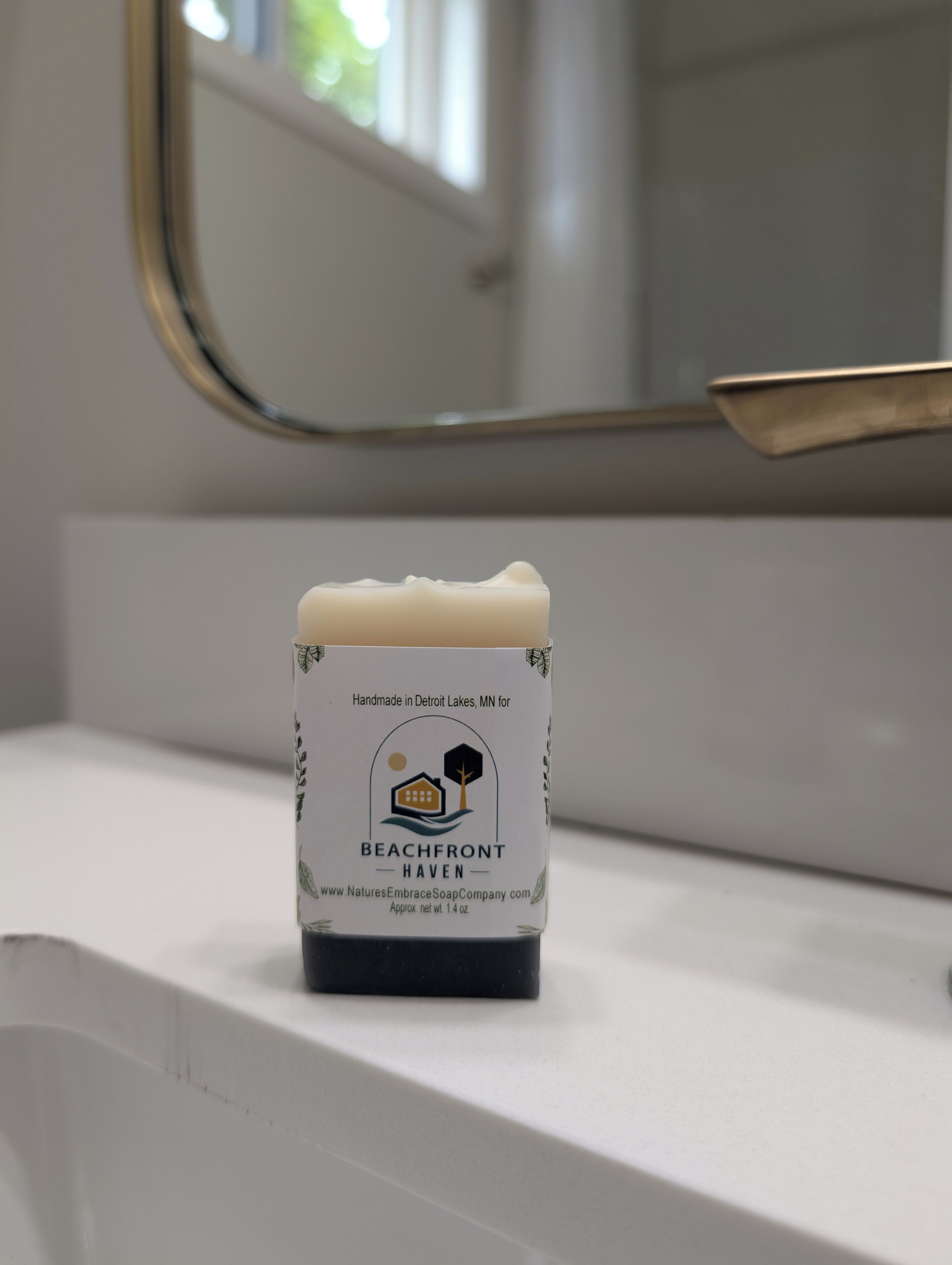 A small bar of Beachfront Haven soap on a bathroom counter.