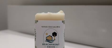 A small bar of Beachfront Haven soap on a bathroom counter.