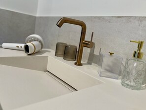 Hair dryer, towels, soap, toilet paper