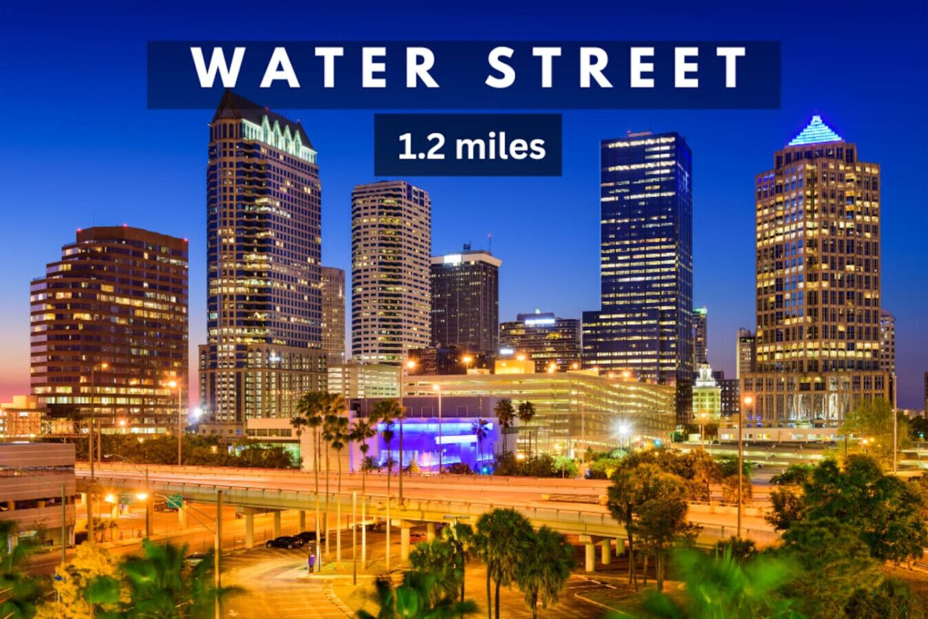 A city skyline with the text "WATER STREET 1.2 miles" indicating the distance to the location.
