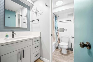 Shower, hair dryer, towels, shampoo