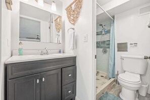 Shower, hair dryer, towels, shampoo