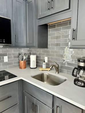 Fridge, microwave, stovetop, coffee/tea maker
