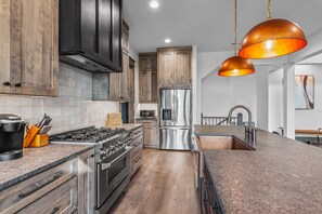 Oven, coffee/tea maker, cookware/dishes/utensils, dining tables