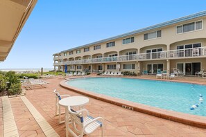 A heated pool - Beachfront Comfort w/ Pool, Patio & Steps to Flagler Avenue (New Smyrna Beach)
