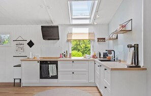 Fridge, stovetop, dishwasher, coffee/tea maker