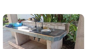 A kitchen with a sink, faucet, and a countertop. - Monte Carlo Camiguin Ruins, Looc Catarman Camiguin (Catarman)