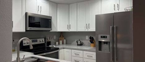 Coffee/tea maker, fridge, microwave, oven