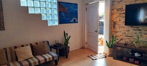 Family House, 3 Bedrooms, 2 Bathrooms, Partial Ocean View | Living area | 55-inch flat-screen TV with digital channels, Netflix