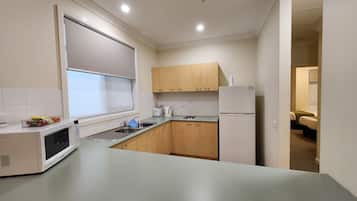 Comfort Apartment, 2 Bedrooms, Kitchen, Courtyard Area | Private kitchen | Full-size fridge, microwave, cookware/dishes/utensils