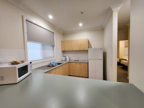 Comfort Apartment, 2 Bedrooms, Kitchen, Courtyard Area | Private kitchen | Full-size fridge, microwave, cookware/dishes/utensils
