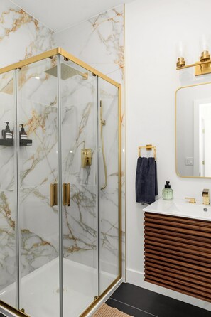 Shower, hair dryer, towels, soap