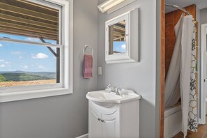 Shower, jetted tub, hair dryer, towels