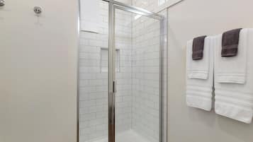 Shower, towels, soap, toilet paper