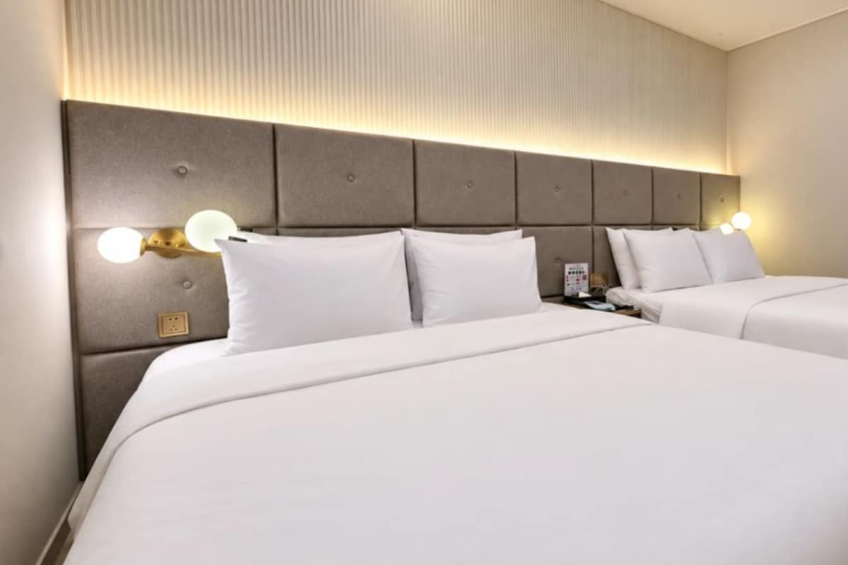 Premium bedding, pillow-top beds, desk, laptop workspace