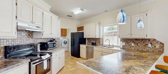 Beautiful home with free wifi, full kitchen, & private yard - steps to the beach