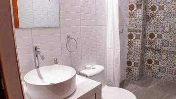 Shower, towels, soap, toilet paper