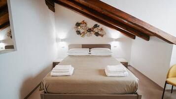 Premium bedding, pillow-top beds, desk, travel cot