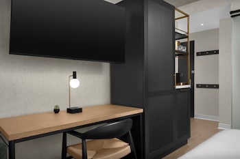 Hotel amenities such as safe, desk and work area at The Livingston, part of JdV by Hyatt