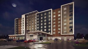 A modern hotel with a prominent entrance, multiple floors, and a parking area. - Hyatt Place Toronto Airport (TORONTO)