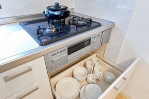 Fridge, microwave, cookware/dishes/utensils