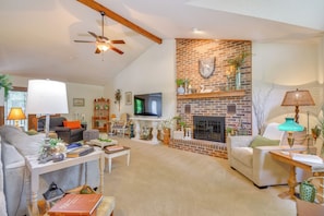 TV, fireplace, books