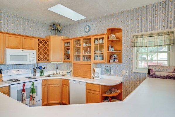 Dishwasher, coffee/tea maker, toaster, cookware/dishes/utensils